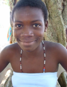 Former slave girl at peace with her scars.