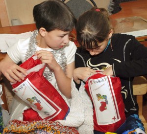 (Photo courtesy SOAR International Ministries) Kids receive their "Stuff a Stocking" gifts.