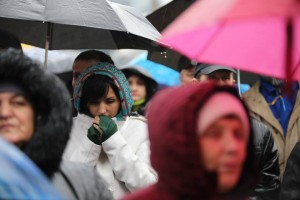 This young woman prays for her country. 