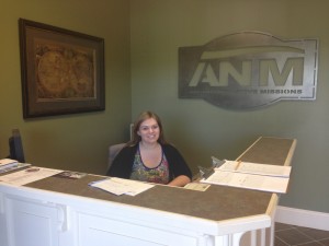 Jessica (summer intern) working at the front desk of Advancing Native Missions. (Photo, caption courtesy ANM)