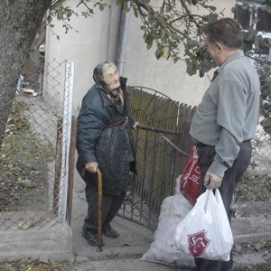 A pastor delivers items provided through SGA's Crisis Evangelism Fund.  (Photo cred: SGA)