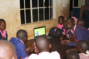 Deaf children in Nigeria watch the Ghanaian sign language Bible.  (Image, caption courtesy DOOR)