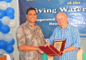 Peter Mazumder at the inauguration of the Living Water Center.  (Screenshot taken from BSFB.org)