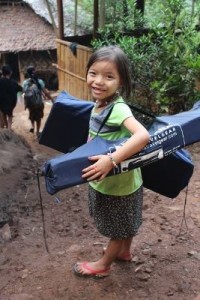 A helper unloading medical equipment pauses for a picture.  (Photo cred: VBB)