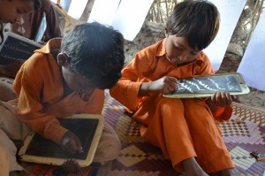 School boys writing on boards (Photo, caption courtesy of Digni Norge via Flickr) CC2.0