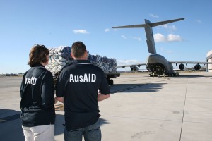 AusAID representatives supervising the loading of supplies in response to flooding in Pakistan.  (Photo cred: AusAID via Wikimedia Commons)