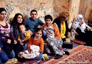 Surviving Syrian refugee family members hold close to one another. (Photo and caption courtesy of Christian Aid Mission)