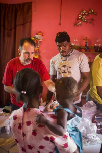 Barry Ewy with malaria patients. (Photo courtesy Blessings Int'l)