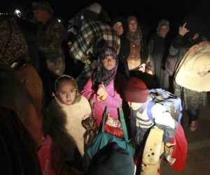 (Photo Courtesy GAiN) Syrian refugees fleeing violence in their country cross into Jordanian territory, near Mafraq February 18, 2013. REUTERS/Muhammad Hamed 