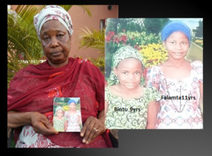 Deborah holding a photo of her two young nieces who were abducted by Boko Haram militants in 2012. (Photo courtesy of Ray and Denice with Voice of the Martyrs, Canada)