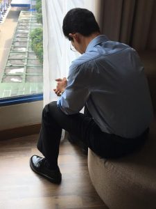 Asian pastor praying