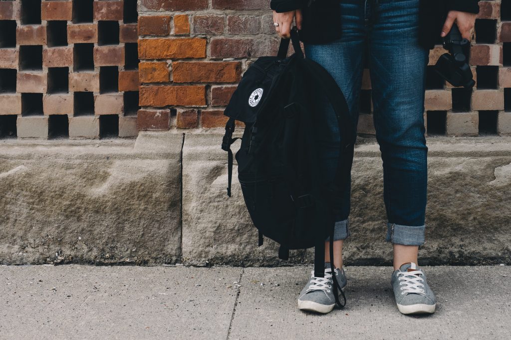 backpack, student, brick wall, unsplash