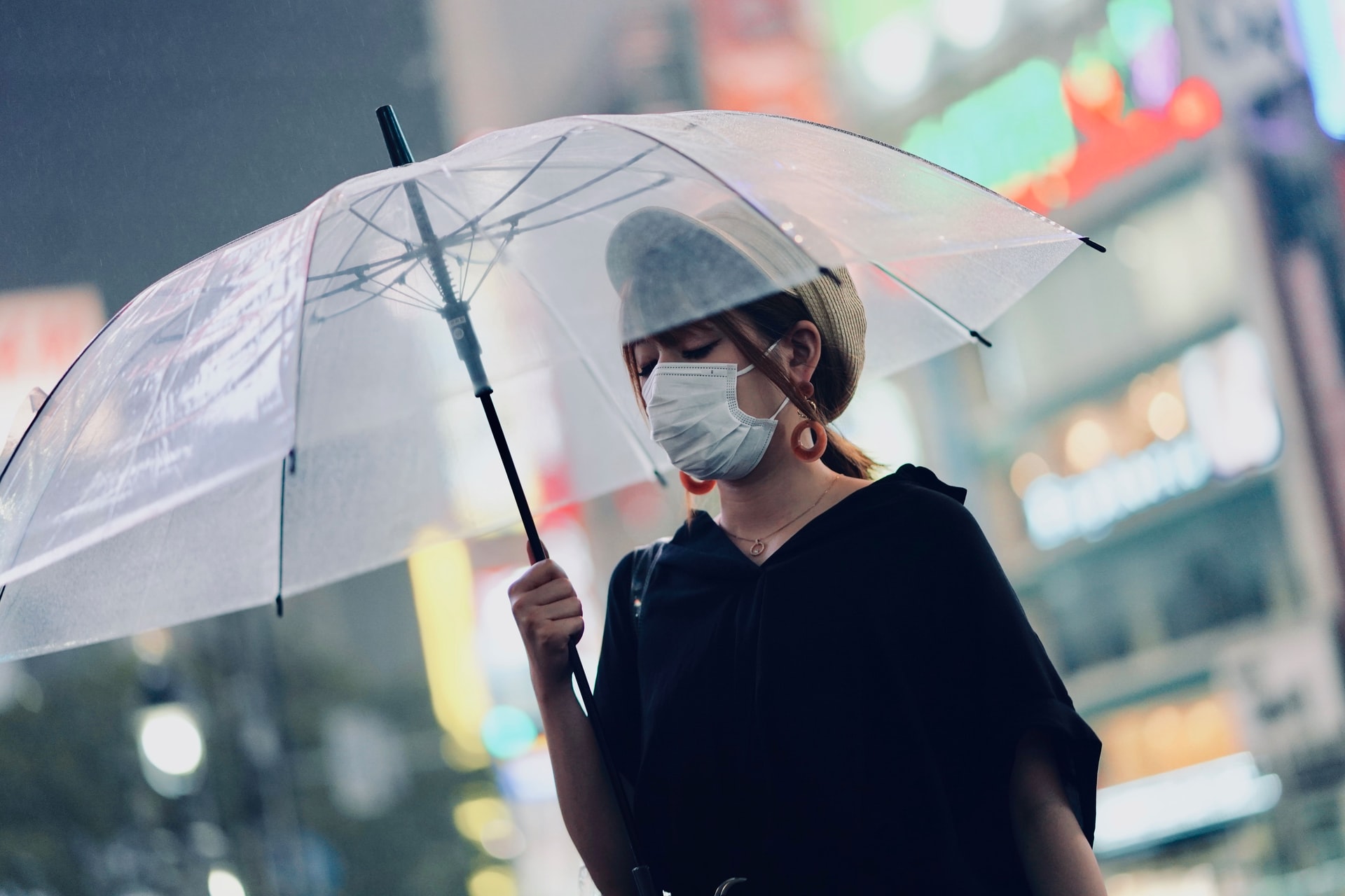 Header image depicts a woman holding a transparent umbrella in Tokyo, Japan. (Stock photo courtesy of Tore F/Unsplash)