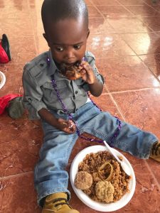 Boy eating rice, For Haiti with Love