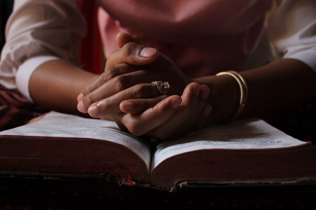 praying over Bible