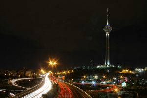 Iran tower and highway at night.